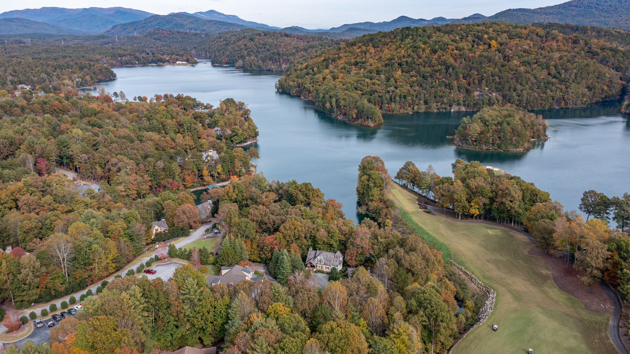 An overhead view of Lake Keowee and with some of the houses and expanses of trees on the other side.