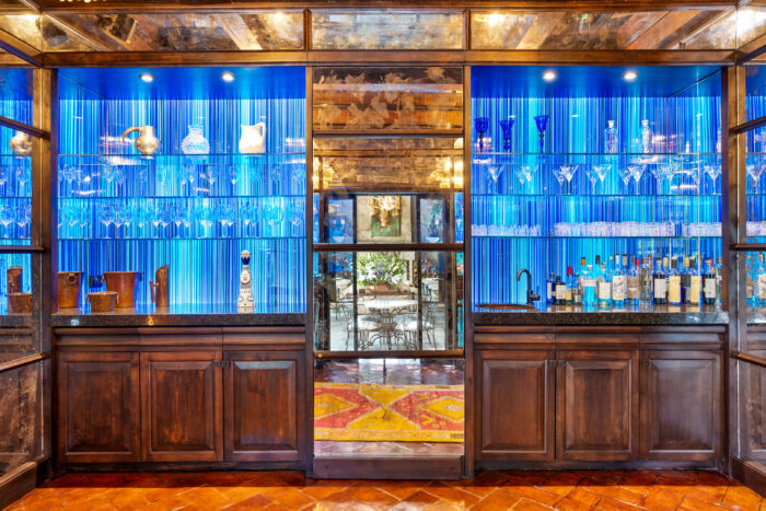 Barroom shelving withe banded-pattern blue glass. 