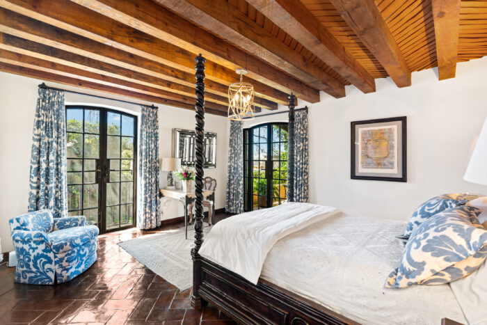 Bedroom with French doors leading out to terrace. 