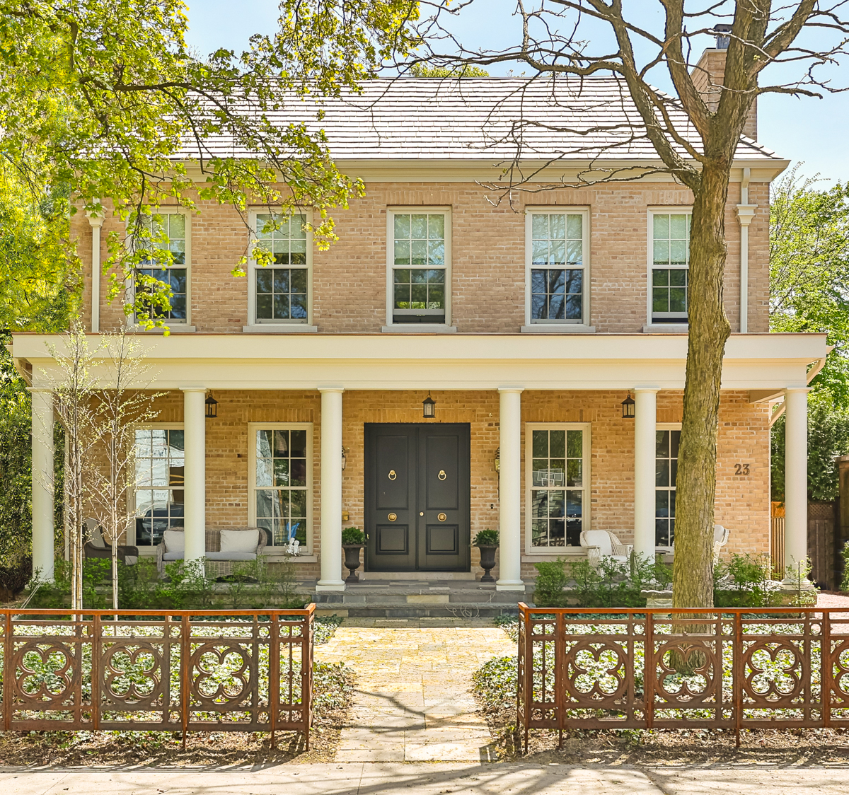 The symmetrical exterior of a Georgian-style home in Lytton Park, Toronto