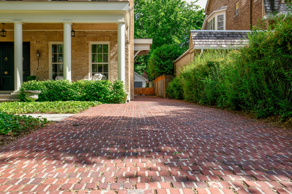 Antique pavers form a patterned driveway at 23 Lytton Park Boulevard, Toronto