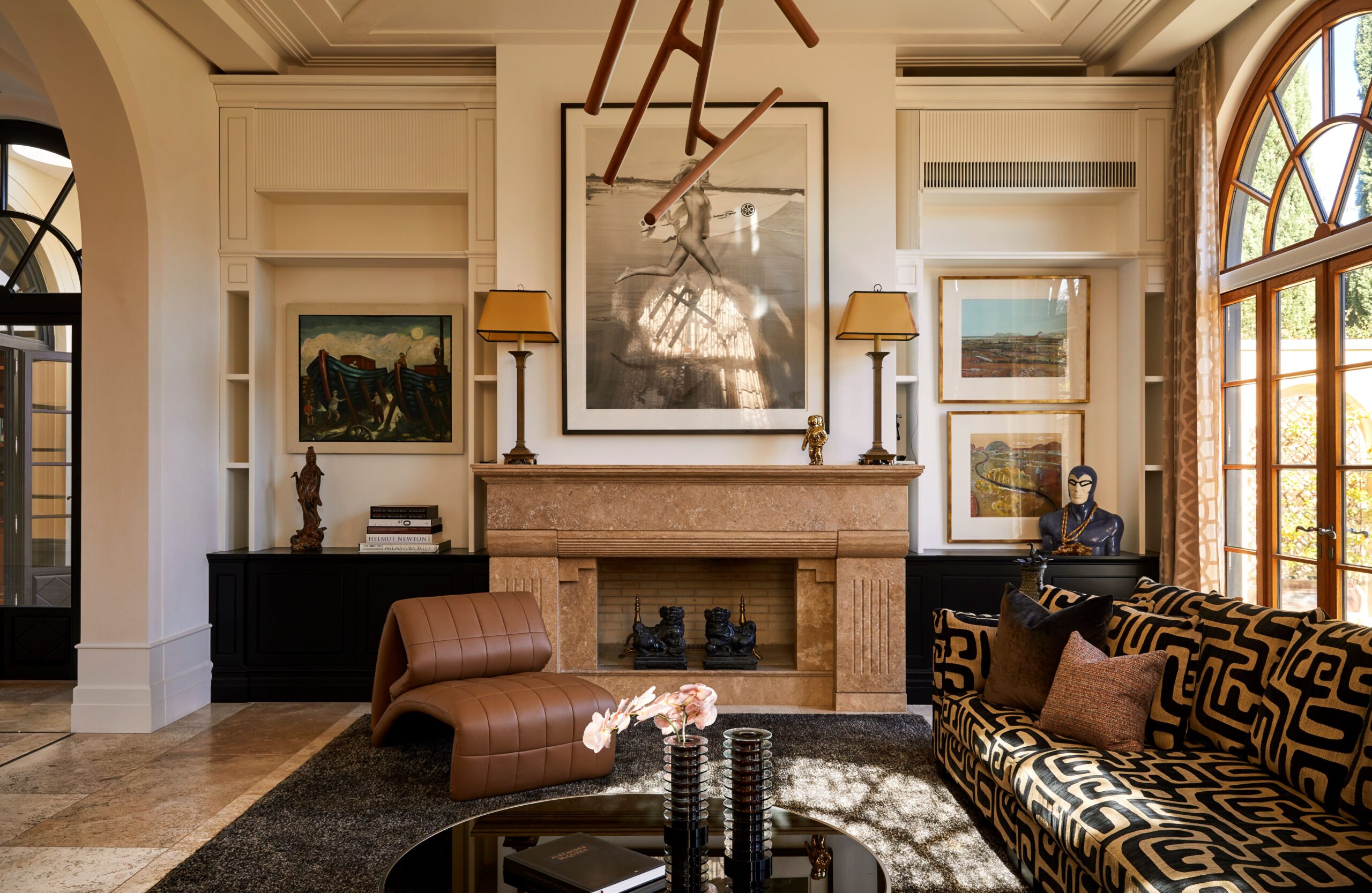 a sitting room with open fireplace