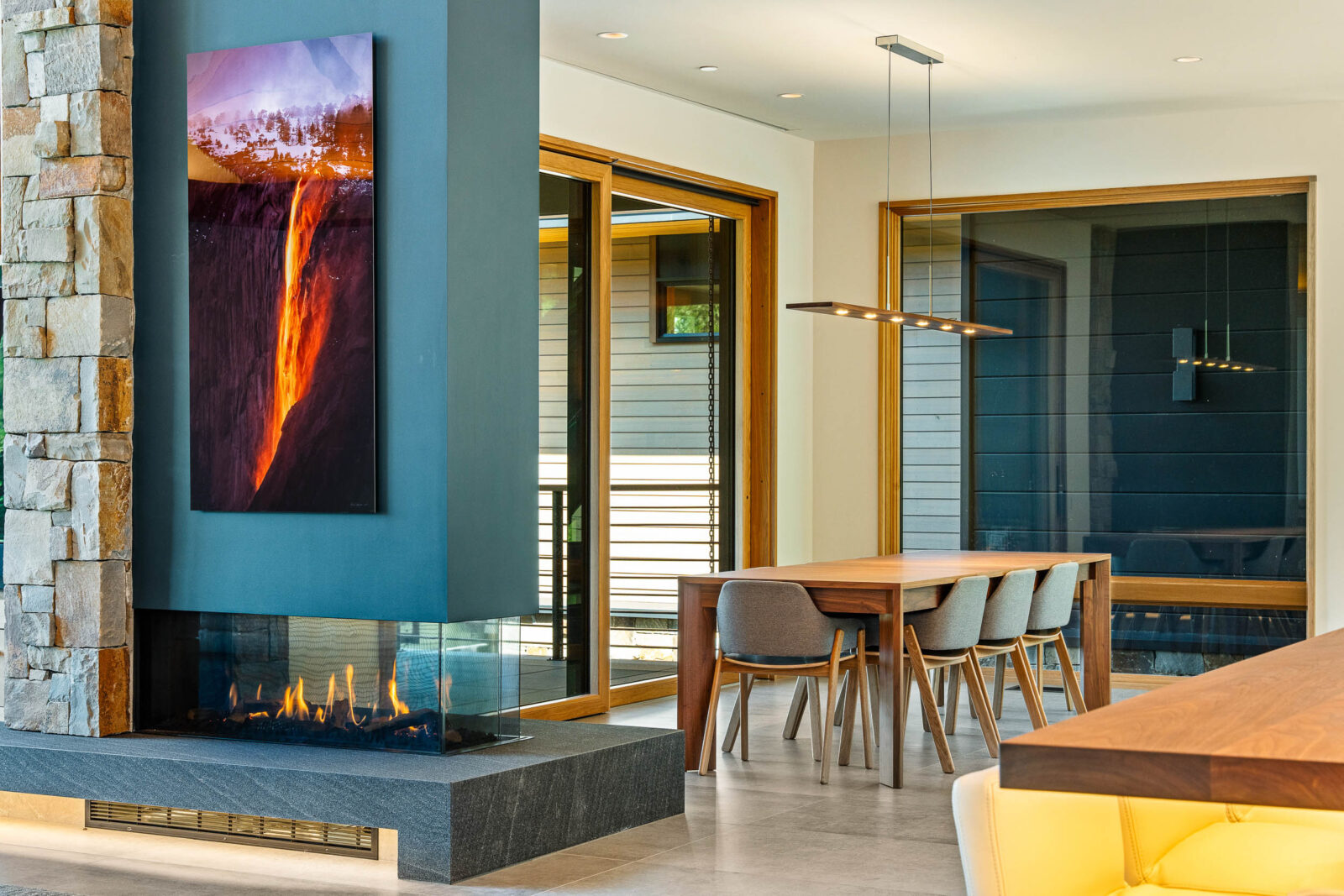 Dining room with two-sided fireplace. 