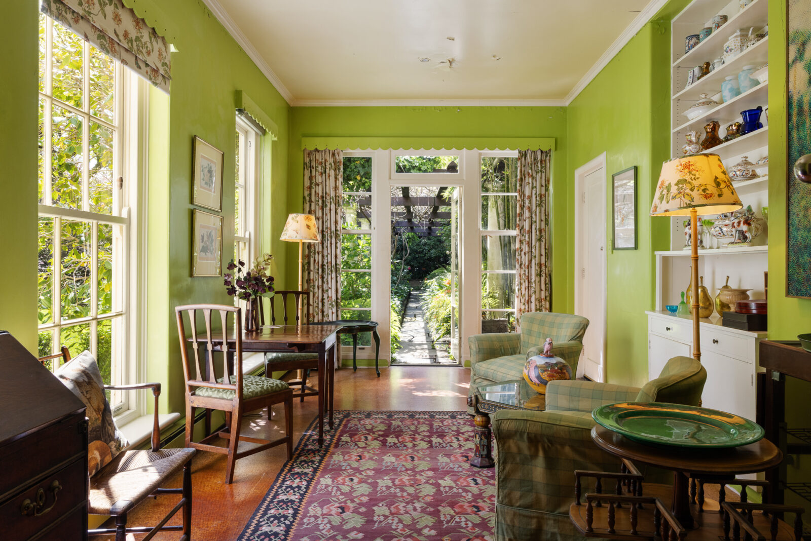 Sitting room with access to outdoor gardens at Toorak estate. 