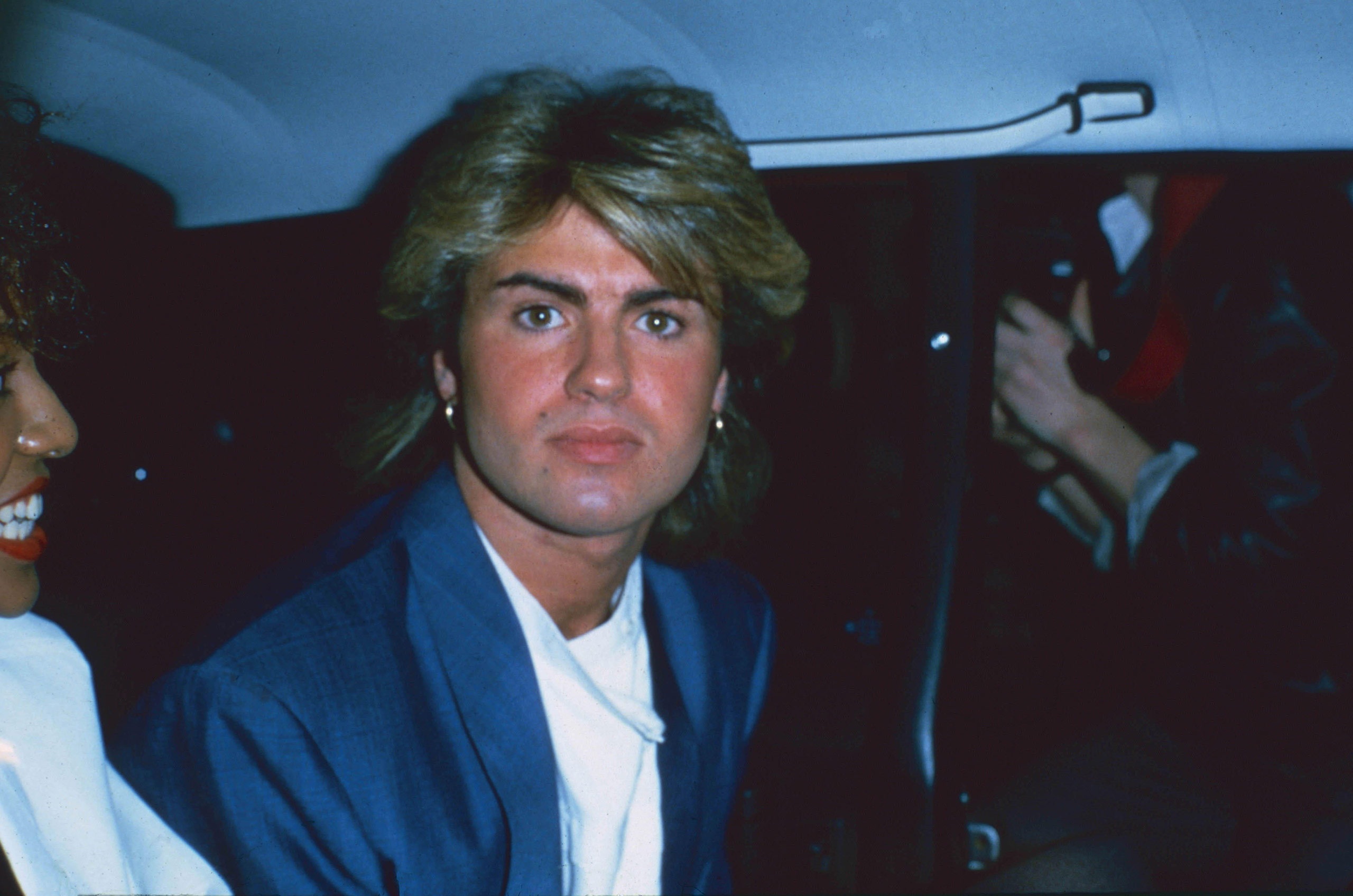 Young George Michael in the back of a car early 1980s