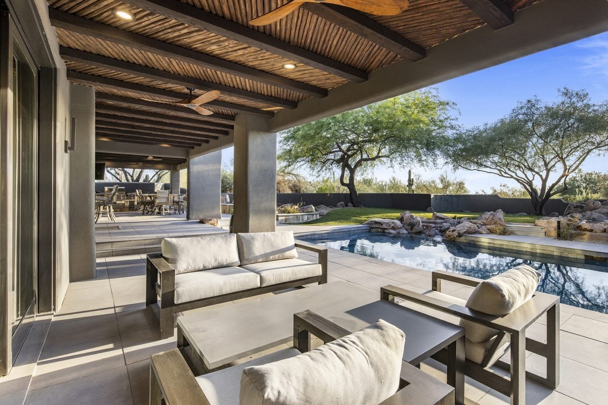 Set within the exclusive Desert Highlands golf community, this modern home is teeming with amenities for the ultimate Southwestern lifestyle.