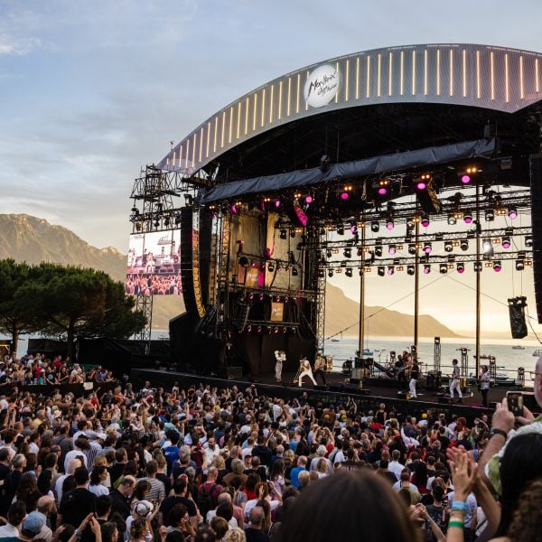 The Lake Stage, framing Lake Geneva (aka Lac Léman), provided an idyllic backdrop for Trombone Shorty's set at the 2024 Montreux Jazz Festival. This year's lineup includes legends like Chaka Khan, Diana Ross, Santana and a tribute to the late, great Quincy Jones. ©Marc Ducrest