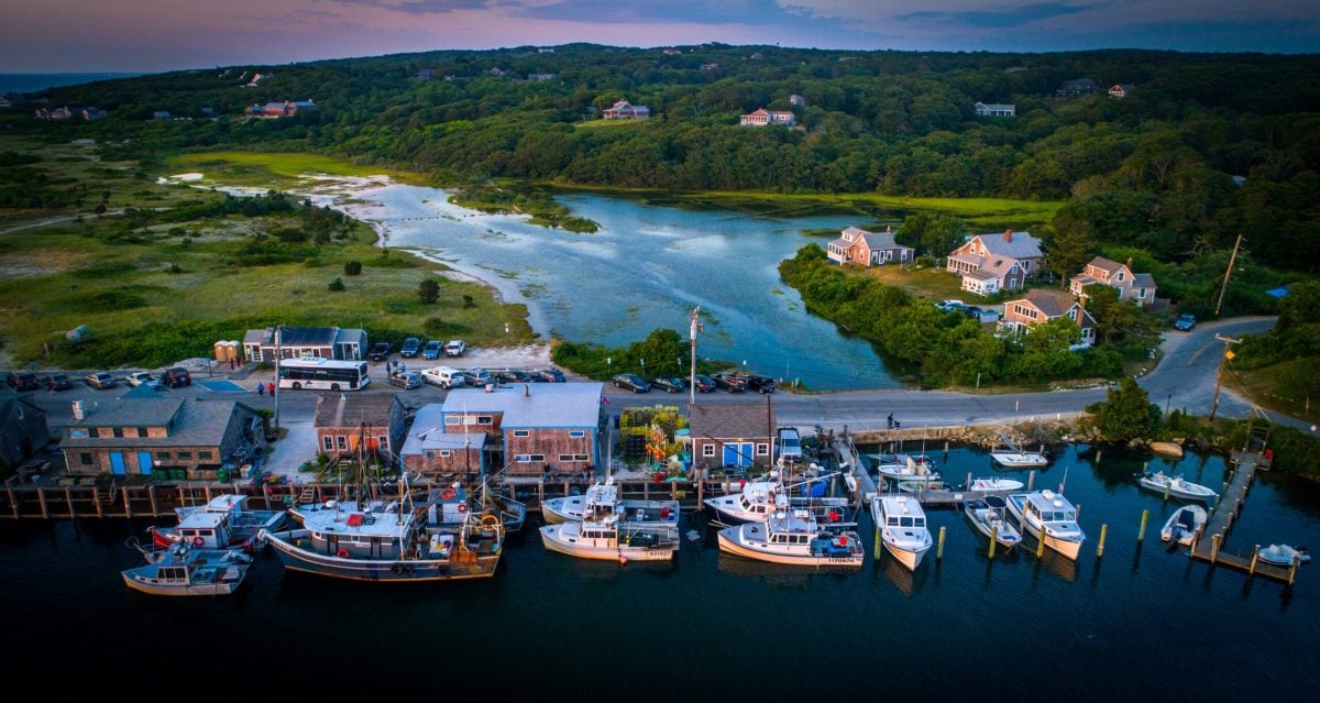 The placid waters of Menemsha Pond eventually find their way to the open horizons of the Vineyard Sound, both sublime settings for sailing. (Tea Lane Associates)